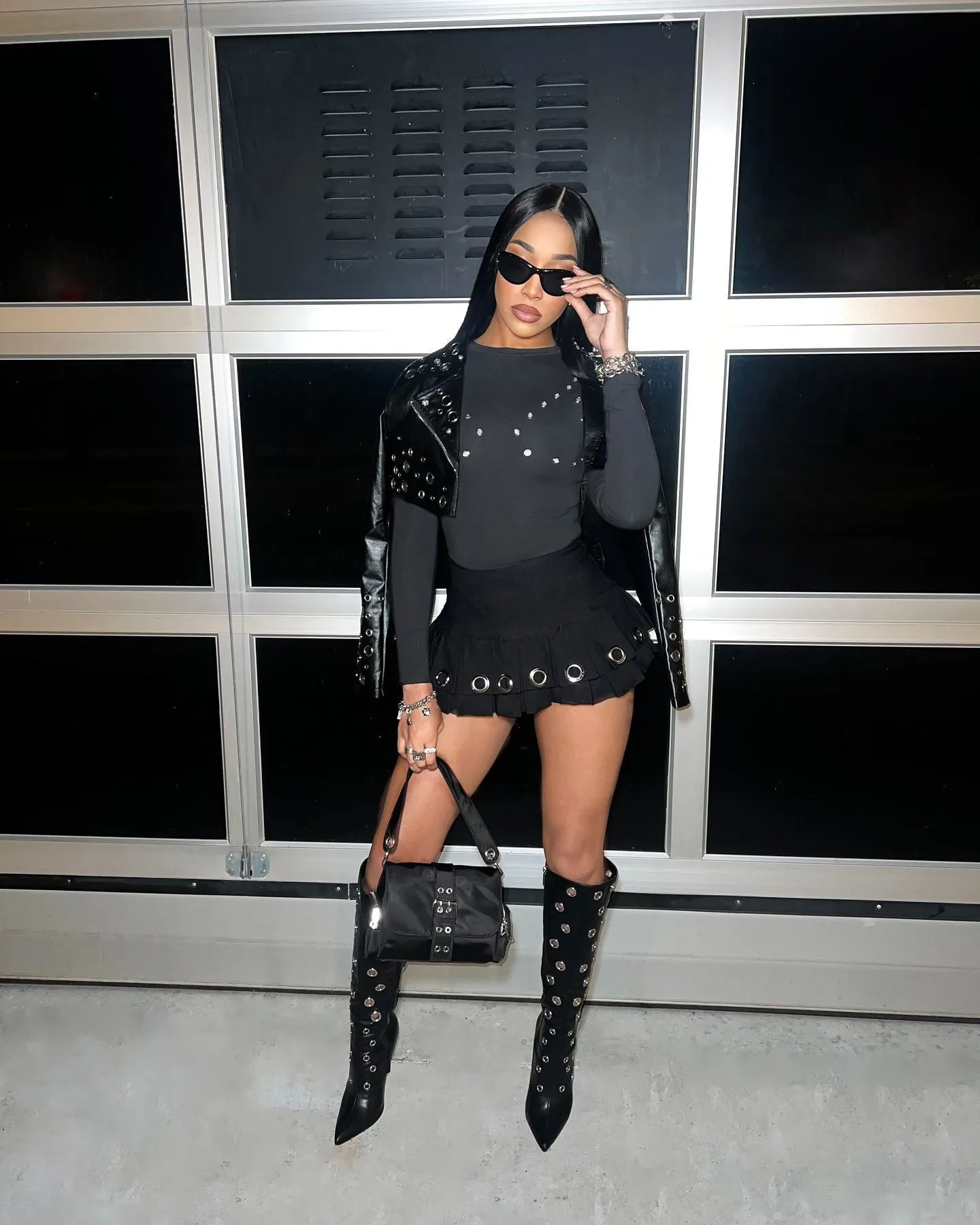 Edgy High-Waisted Pleated Mini Skirt with Bold Punk Aesthetic